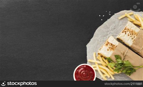 top view delicious kebab with ketchup french fries