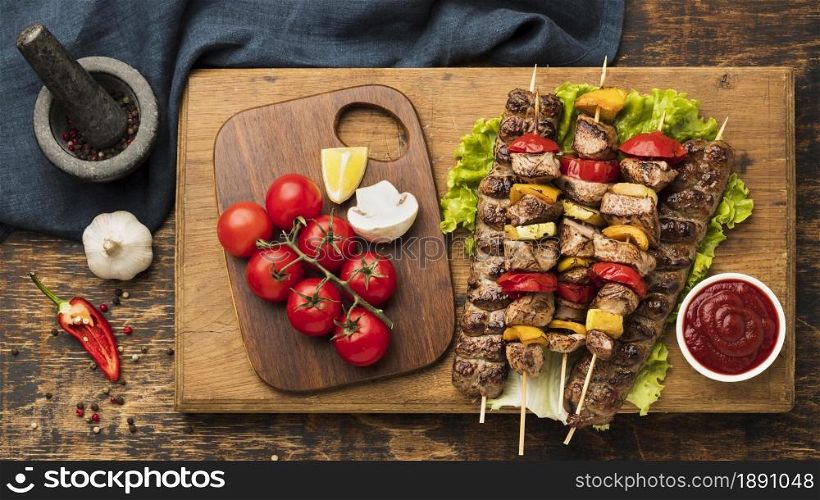 top view delicious kebab with meat vegetables chopping board. Resolution and high quality beautiful photo. top view delicious kebab with meat vegetables chopping board. High quality and resolution beautiful photo concept
