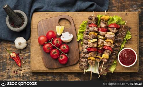 top view delicious kebab with meat vegetables chopping board. Resolution and high quality beautiful photo. top view delicious kebab with meat vegetables chopping board. High quality and resolution beautiful photo concept
