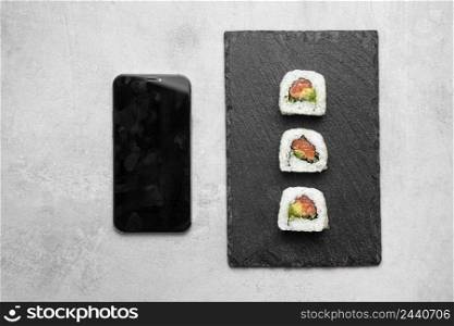 top view delicious sushi smartphone