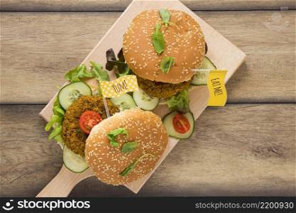 top view delicious vegan burgers wooden board
