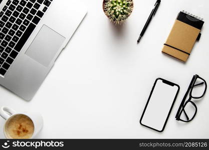 top view desk with laptop plant