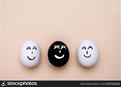top view different colored eggs with faces black lives matter movement