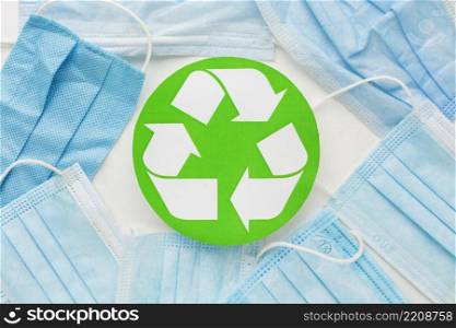 top view disposable medical masks recycle symbol