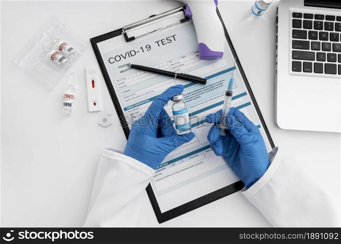 top view doctor holding covid vaccine 1. Resolution and high quality beautiful photo. top view doctor holding covid vaccine 1. High quality and resolution beautiful photo concept