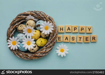 top view easter eggs basket with greeting chamomile flowers