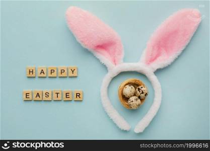 top view easter eggs with greeting bunny ears