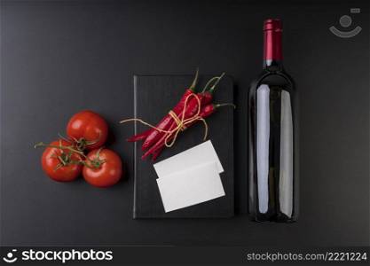 top view empty menu book with wine bottle tomatoes