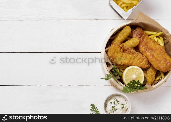 top view fish chips bowl with lemon