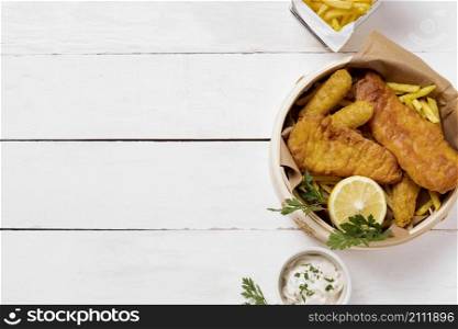 top view fish chips bowl with lemon