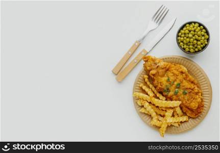 top view fish chips dish with peas copy space