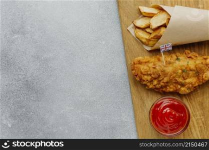 top view fish chips paper wrap with ketchup copy space