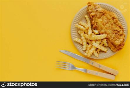 top view fish chips plate with cutlery