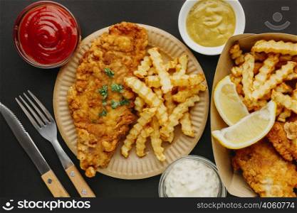 top view fish chips with cutlery selection sauces