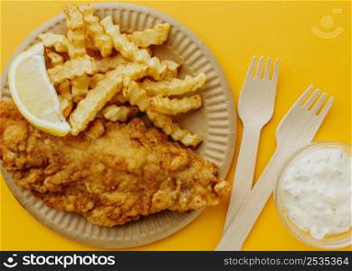 top view fish chips with forks lemon