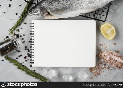 top view fish notebook arrangement