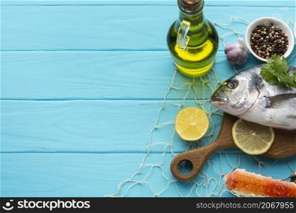 top view fish with condiments oil