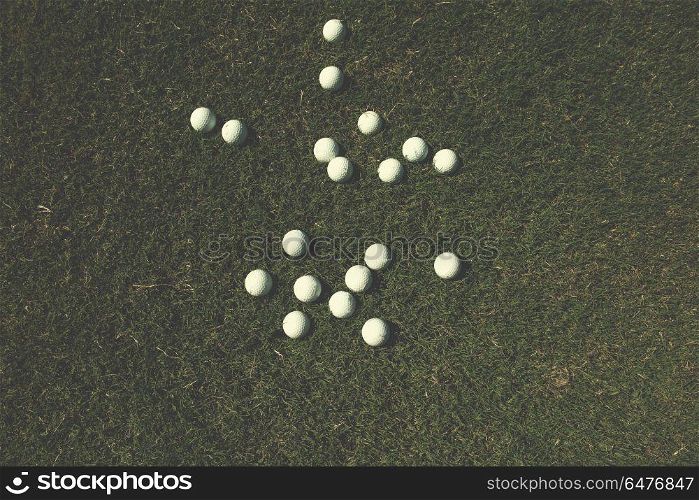 top view flat lay of golf balls with driver on grass background. golf balls background