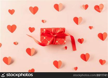 Top view flat lay of paper hearts and gift box on pastel pink background surprise your loved with space for text, birthday greeting, web design banner holiday, Happy Valentine Day Background
