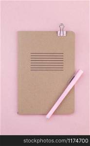 Top view flat lay of woman workspace desk styled design office supplies with copy space on a millennial pink color paper background minimal style. Template for feminine blog social media