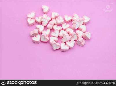 Top view, Flatlay template design a group of candy color of marshmallows with heart shaped on pink background with copy space, For web banner, brochure, menu template