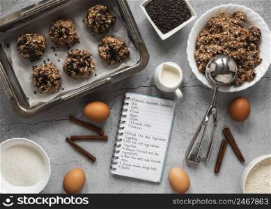 top view food ingredients with notebook dessert mix