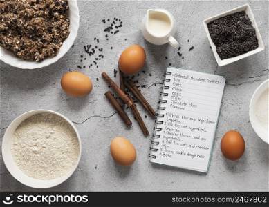top view food ingredients with notebook dessert mix 3