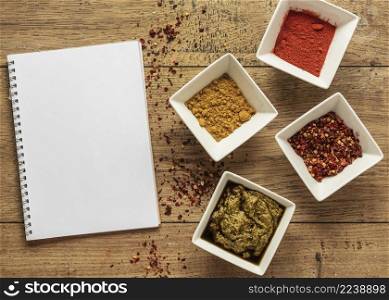 top view food ingredients with notebook spices
