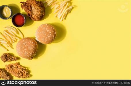 top view fried chicken burgers fries with copy space. Resolution and high quality beautiful photo. top view fried chicken burgers fries with copy space. High quality and resolution beautiful photo concept