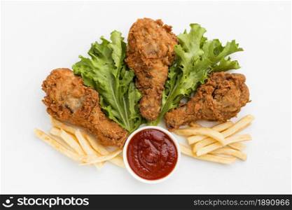 top view fried chicken drumsticks with fries ketchup. Resolution and high quality beautiful photo. top view fried chicken drumsticks with fries ketchup. High quality and resolution beautiful photo concept