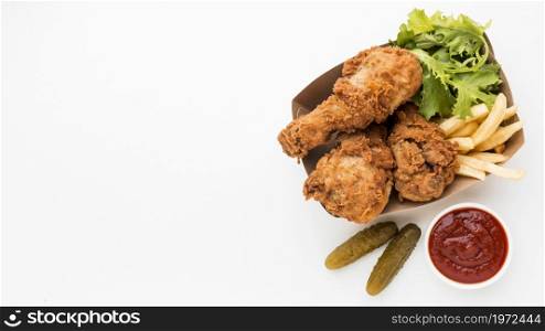 top view fried chicken drumsticks with ketchup fries with copy space. High resolution photo. top view fried chicken drumsticks with ketchup fries with copy space. High quality photo