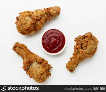 top view fried chicken drumsticks with ketchup. Resolution and high quality beautiful photo. top view fried chicken drumsticks with ketchup. High quality and resolution beautiful photo concept