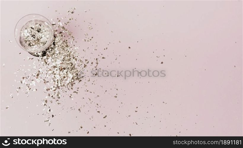 top view glass filled with silver glitter copy space. Resolution and high quality beautiful photo. top view glass filled with silver glitter copy space. High quality and resolution beautiful photo concept