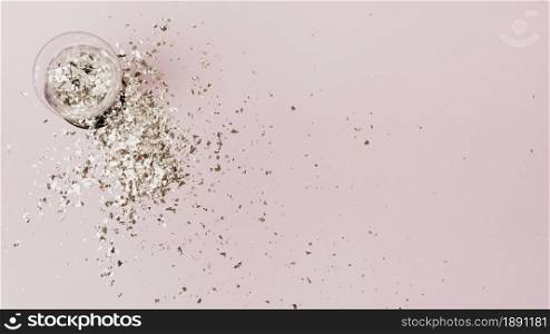 top view glass filled with silver glitter copy space. Resolution and high quality beautiful photo. top view glass filled with silver glitter copy space. High quality and resolution beautiful photo concept