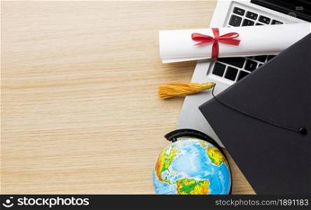 top view globe with academic cap laptop. Resolution and high quality beautiful photo. top view globe with academic cap laptop. High quality and resolution beautiful photo concept
