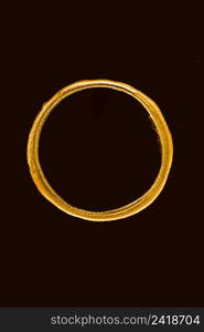 top view golden melted circle black background