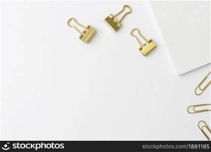 top view golden paperclips with copy space. Resolution and high quality beautiful photo. top view golden paperclips with copy space. High quality and resolution beautiful photo concept
