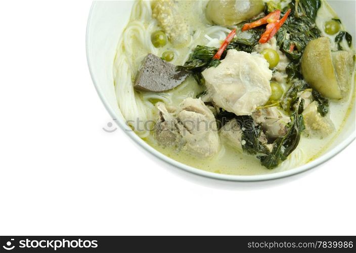 top view green chicken curry served with rice vermicelli in white bowl over white background
