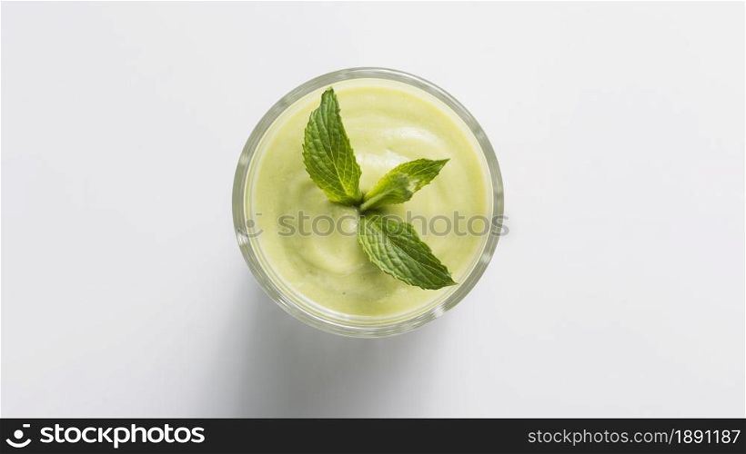 top view green smoothie glass with mint. Resolution and high quality beautiful photo. top view green smoothie glass with mint. High quality and resolution beautiful photo concept