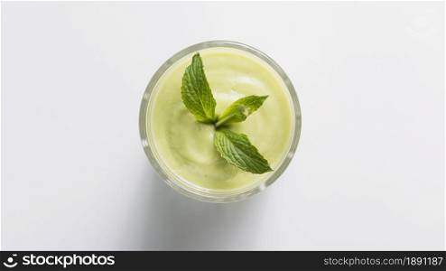 top view green smoothie glass with mint. Resolution and high quality beautiful photo. top view green smoothie glass with mint. High quality and resolution beautiful photo concept