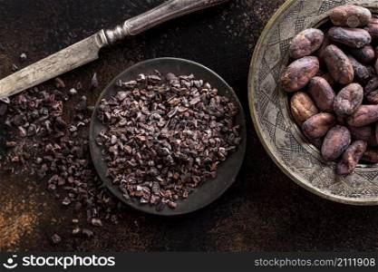 top view grounded cocoa beans plate with knife cocoa beans