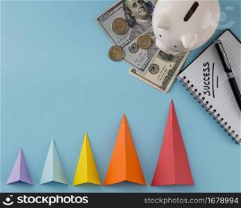 top view growth cones with banknotes piggy bank