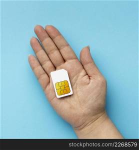 top view hand holding sim card