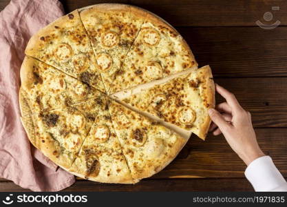 top view hand taking slice pizza cheese. High resolution photo. top view hand taking slice pizza cheese. High quality photo