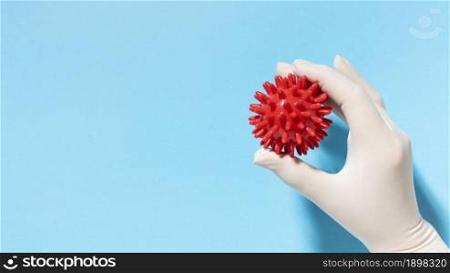 top view hand with glove holding virus with copy space. Resolution and high quality beautiful photo. top view hand with glove holding virus with copy space. High quality beautiful photo concept
