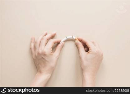 top view hands breaking cigarette