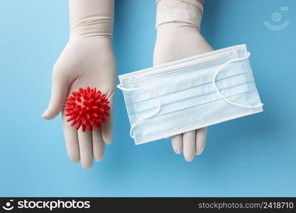 top view hands holding virus medical mask