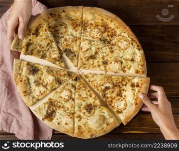 top view hands taking slices pizza with cheese