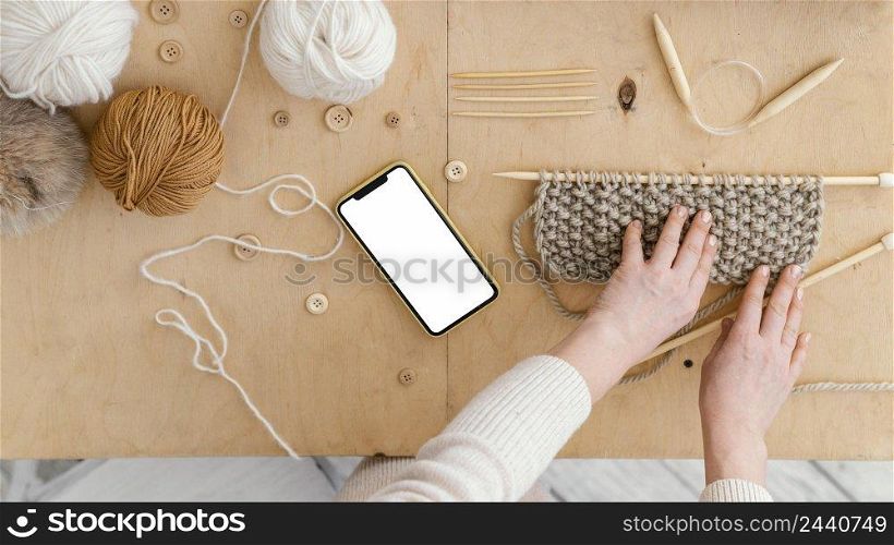 top view hands with knitting desk