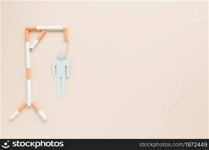 top view hanging man made by cigarettes. High resolution photo. top view hanging man made by cigarettes. High quality photo